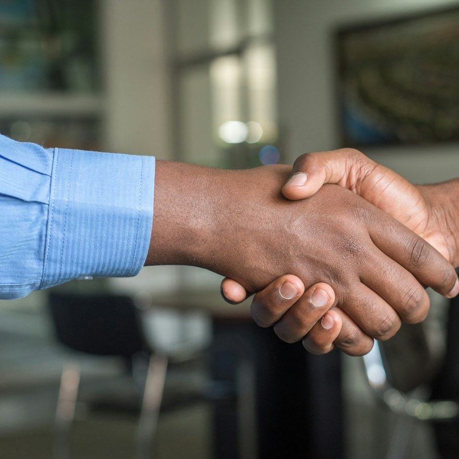 Employer and employee shaking hands